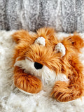A plush fox lovey made by ClaraLoo with soft orange faux fur and crocheted ears.